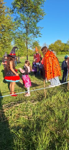 Outdoor community activities with costumed participants and children